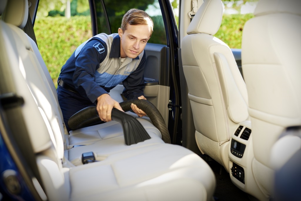 Close-up of Honda vehicle paint being polished and restored during full detail service at Honda Libertyville in Lake County IL
