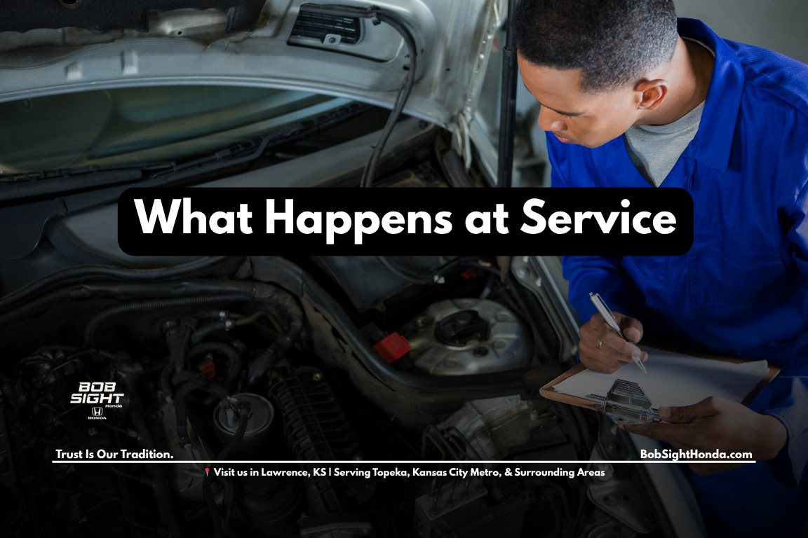 Honda service appointment in Lawrence Kansas at Bob Sight Honda with technicians inspecting vehicle for Kansas City Metro drivers