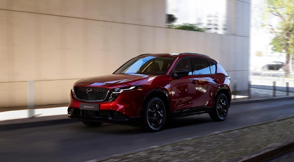 Red 2026 Mazda CX-5 for sale near Porter driving on a city street