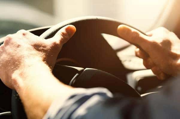 Hands on steering wheel