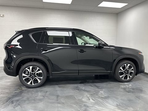 black 2026 Mazda CX-5 crossover parked at the Bountiful Mazda dealership in Bountiful, UT