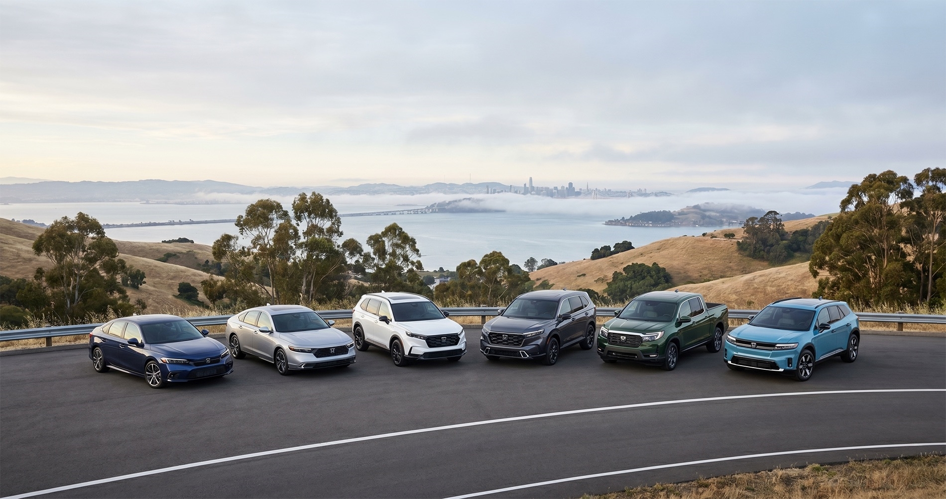 Lineup of Honda Civic, Accord, CR-V, Pilot, Ridgeline, and Prologue at an East Bay scenic overlook above the San Francisco Bay, showcasing fuel-efficient Honda models for daily driving and commuting