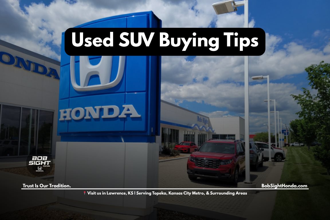 Used Honda SUVs in Lawrence Kansas lined up at a dealership showing CR-V and Pilot models for buyers comparing reliable pre-owned options