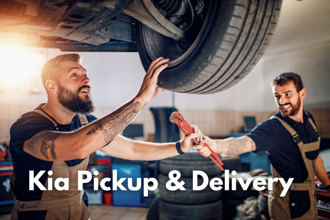 Kia pickup and delivery service in Independence MO with technicians performing tire service at Bob Sight Kia