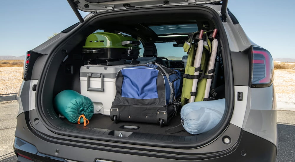 Bags sitting in the trunk of a grey 2026 Kia Sportage.