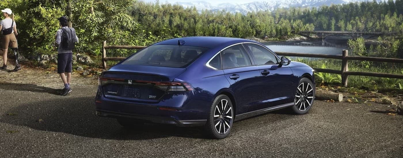 A blue 2026 Honda Accord parked near hikers.