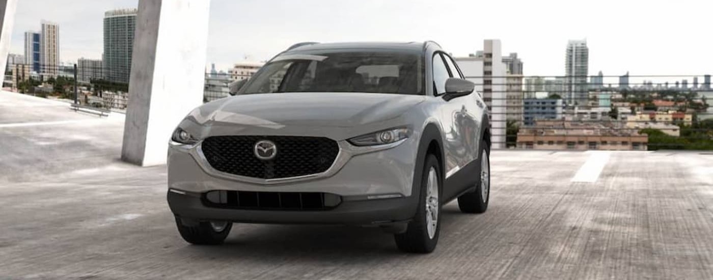 A silver 2026 Mazda CX-30 Parked in a city.