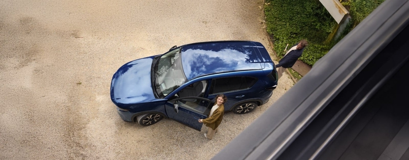 Blue 2026 Mazda CX-5 parked on a driveway