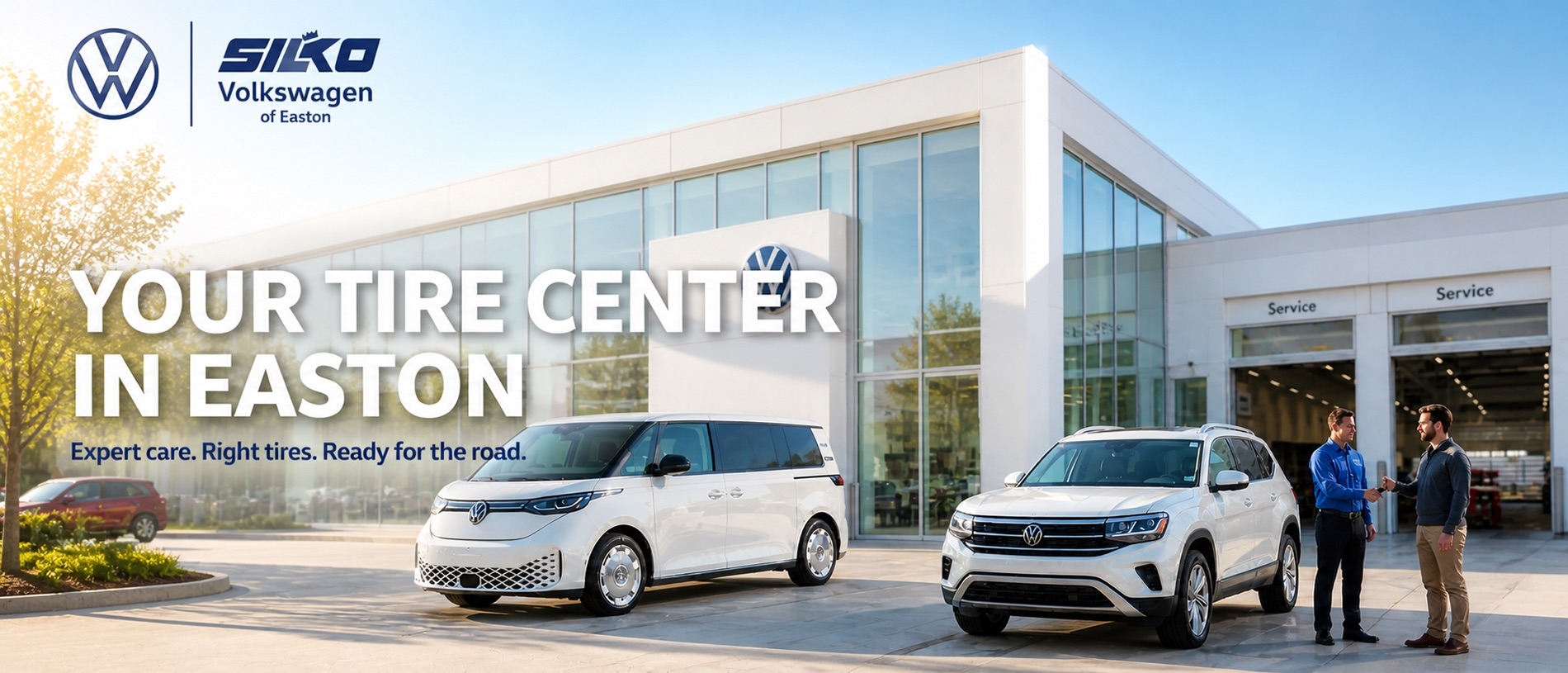 Silko Volkswagen of Easton dealership exterior in bright morning light with Volkswagen vehicles parked out front and a customer speaking with a service advisor near the service entrance