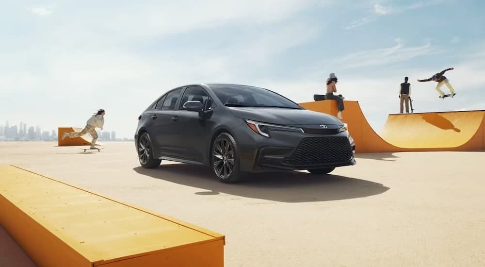 A gray 2026 Toyota Corolla parked near a skate park.