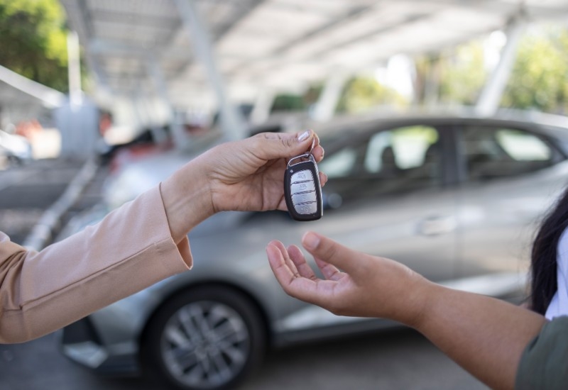 Car keys being handed over during the vehicle sale process in Akron, OH