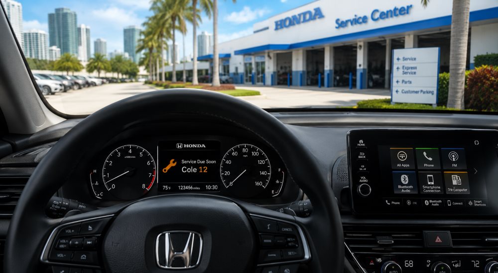Honda multi-information display showing amber Maintenance Minder wrench icon and service code - Brickell Honda Miami