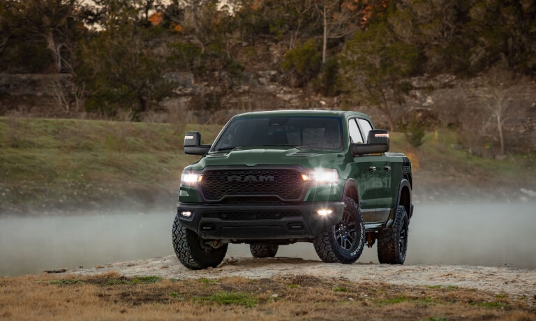2026 Ram 1500 with lights on by foggy river