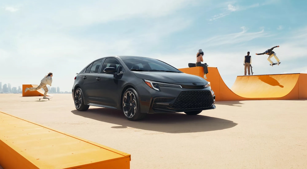 Black 2026 Toyota Corolla parked near a skate park.