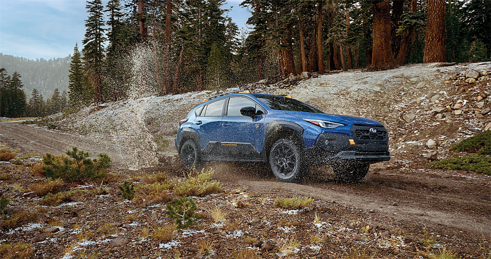 Compact Subaru Crosstrek SUV driving off-road