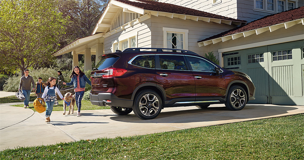 Three-row Subaru Ascent midsize SUV exterior with family