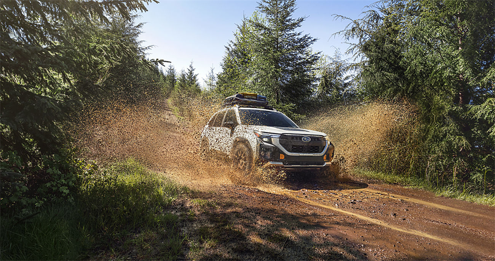 2026 Subaru Forester Wilderness trim displaying its high ground clearance on an off-road trail