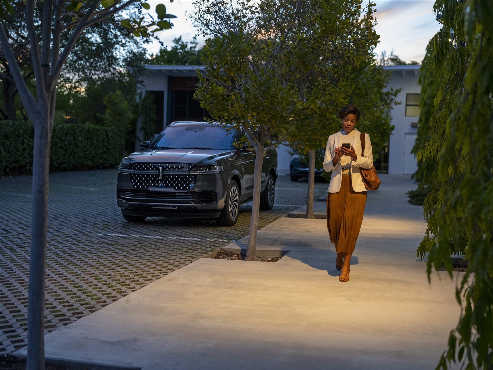 Lincoln Aviator parked in a residential driveway at dusk