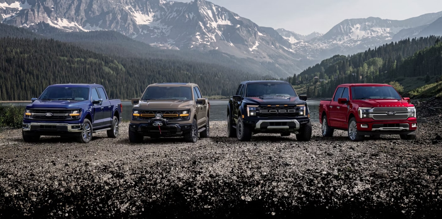 Full lineup of F-150® pickups parked overlooking a mountain range