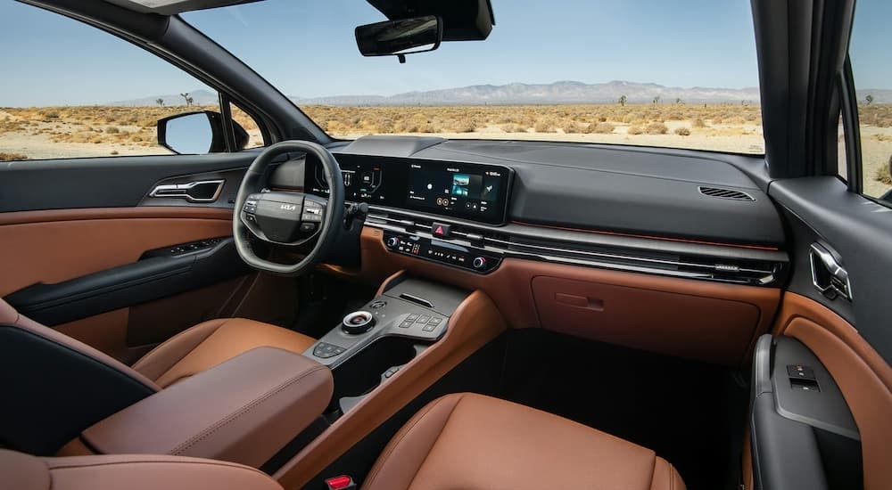 Black and brown interior and dash in a 2026 Kia Sportage Plug-In Hybrid.