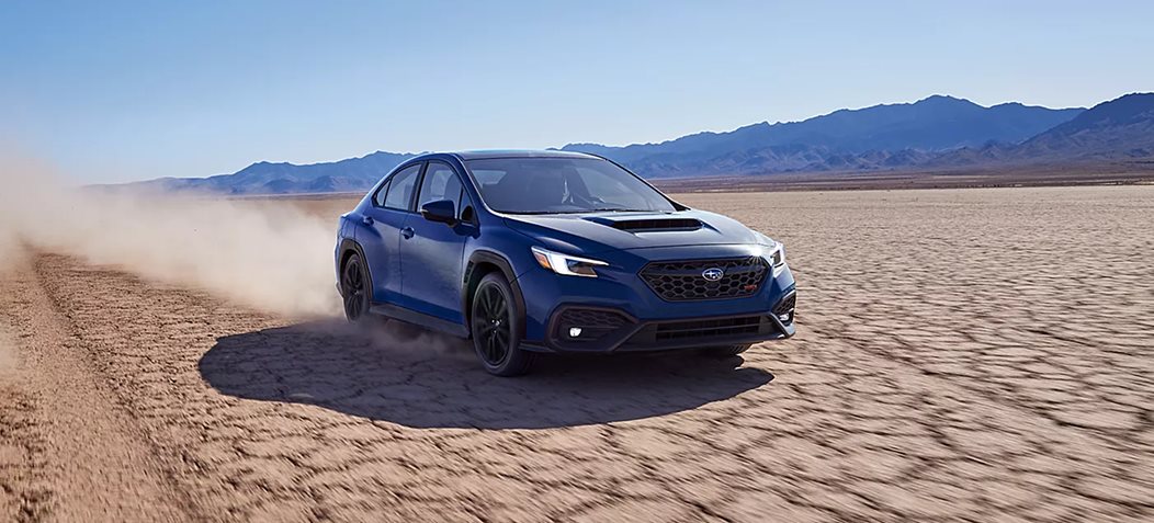 2026 Subaru WRX navigating a dirt trail showcasing Symmetrical All-Wheel Drive traction