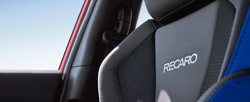 WRX tS interior showing blue-trimmed Recaro performance-design front seats and digital instrument cluster