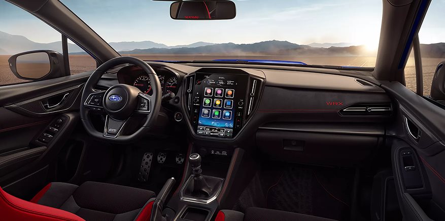 2026 Subaru WRX full dashboard view with 11.6-inch touchscreen, climate controls, and D-shaped steering wheel
