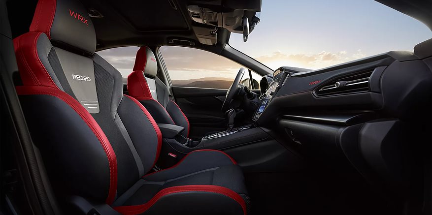 2026 Subaru WRX driver-focused cockpit angle showing instrument cluster, center console, and sport seats
