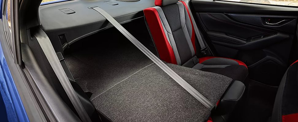 2026 Subaru WRX rear trunk loaded with luggage demonstrating spacious 12.5-cubic-foot cargo capacity