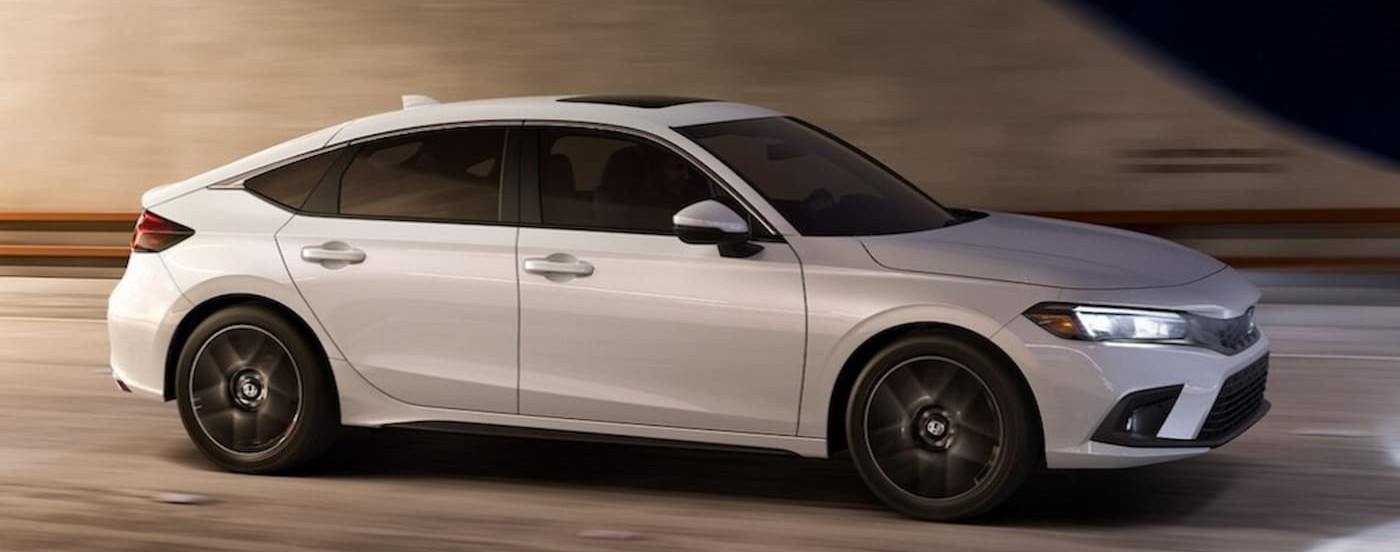A white 2026 Honda Civic driving in a tunnel.