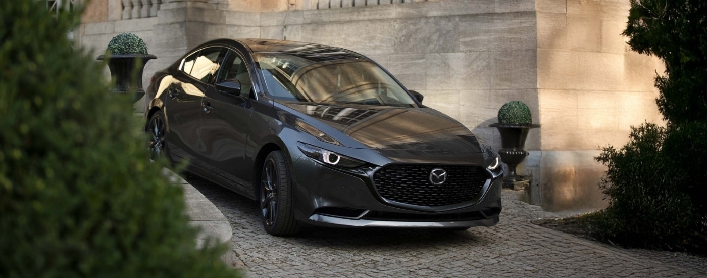 [Grey 2026 Mazda3 for sale on a driveway