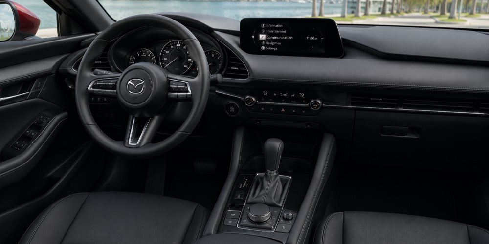 2026 Mazda3 Sedan interior showing the Mazda Connect display and leatherette seating