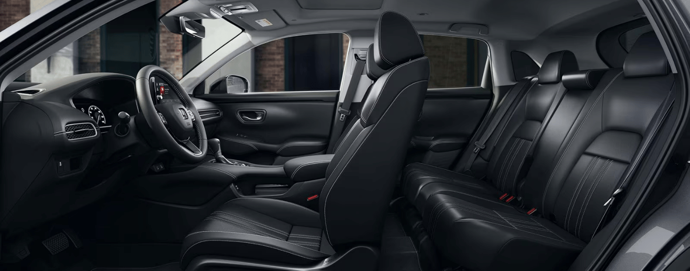 Cutout side-view of the black interior of a 2027 Honda HR-V