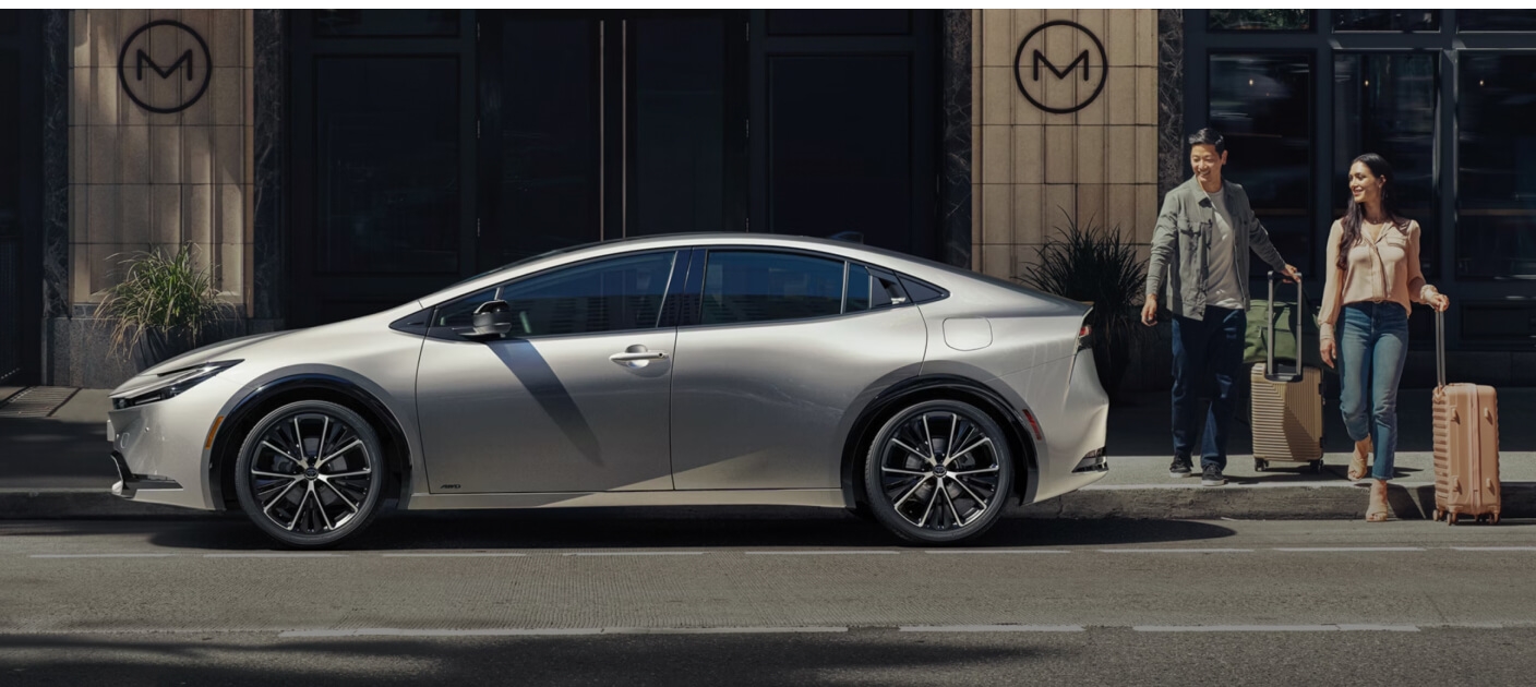 Toyota Prius XLE showcased broadside in urban setting.