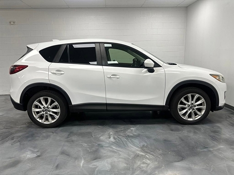 a used white 2014 Mazda CX-5 SUV parked at the Bountiful Mazda dealership