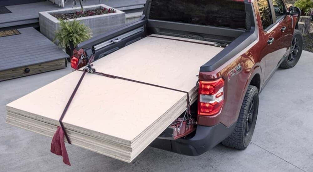 Wood in the bed of a red 2025 Ford Maverick