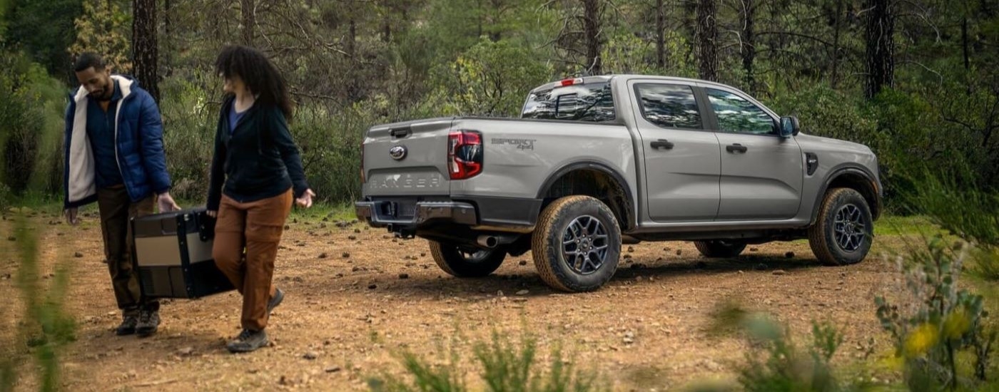 Rear of a silver 2026 Ford Ranger parked off-road.