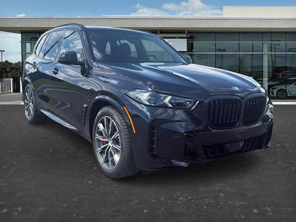 Side profile view of the 2026 BMW X5 highlighting its athletic stance