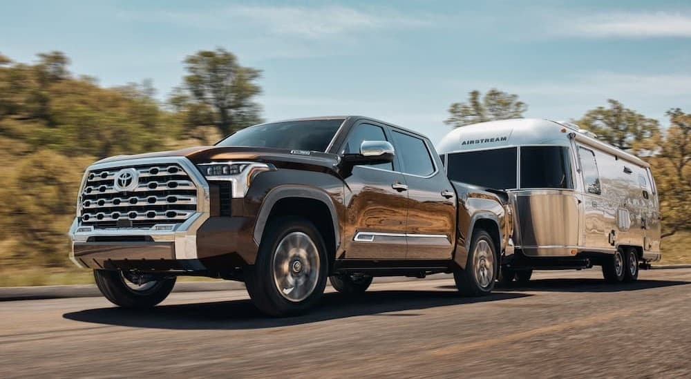 A gray 2026 Toyota Tundra towing a trailer.
