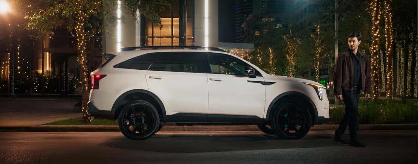 A white 2026 Kia Sorento parked in a city.