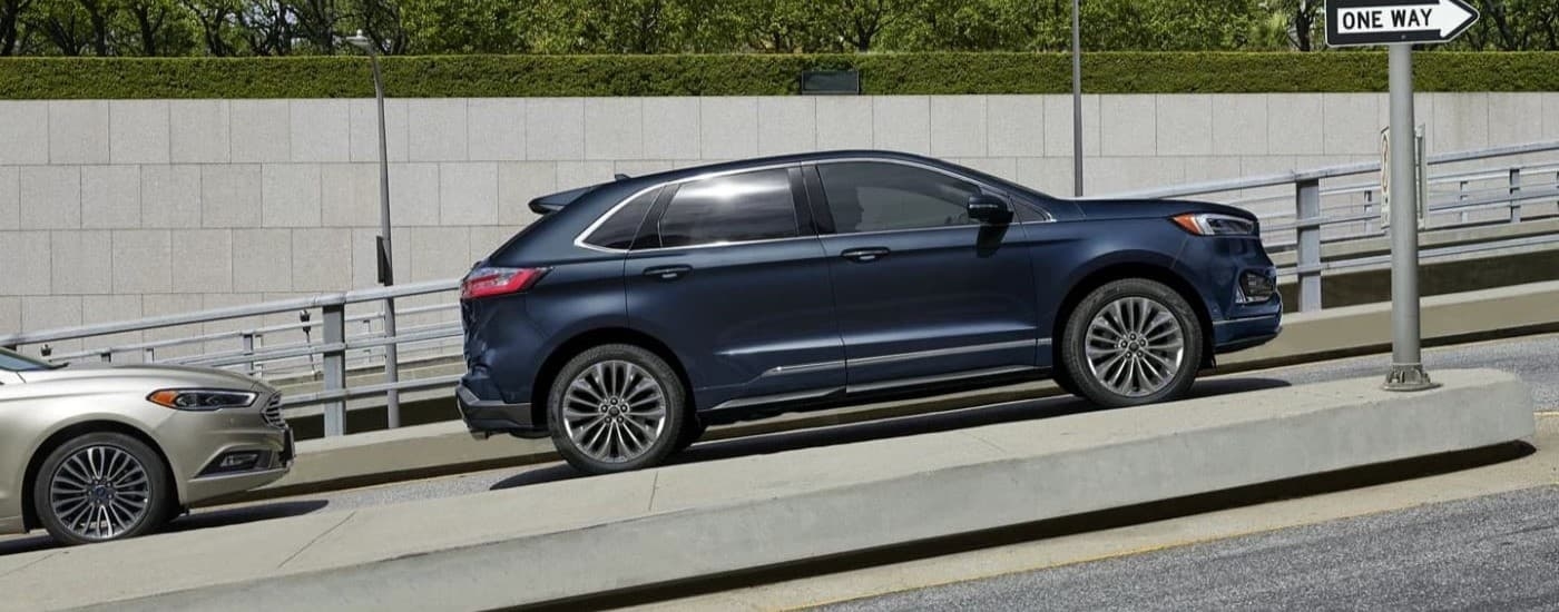 Dark blue 2023 Ford Edge driving to a Ford Dealer in Atlanta, GA