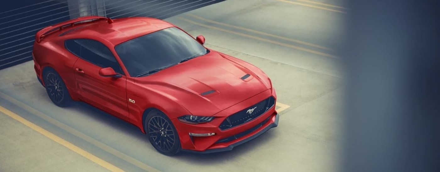 Red 2023 Ford Mustang GT at a parking garage after leaving a Ford dealer