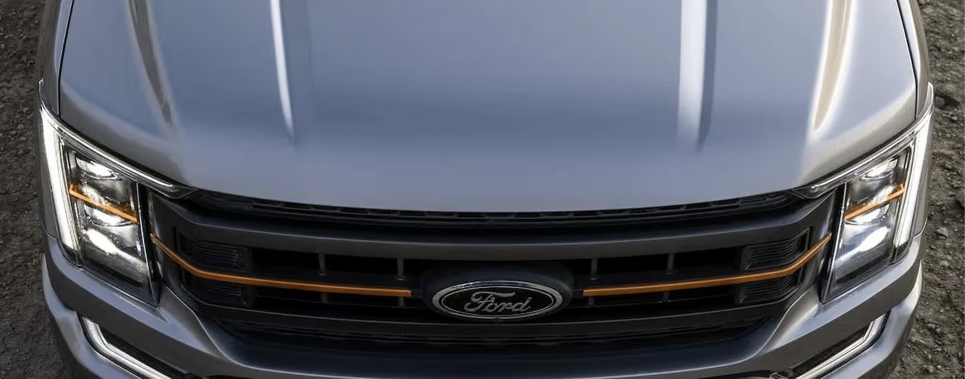 A close up of the hood of grey 2022 Ford F-150 Tremor is shown at a Ford F-150 dealer near East Cobb, GA.