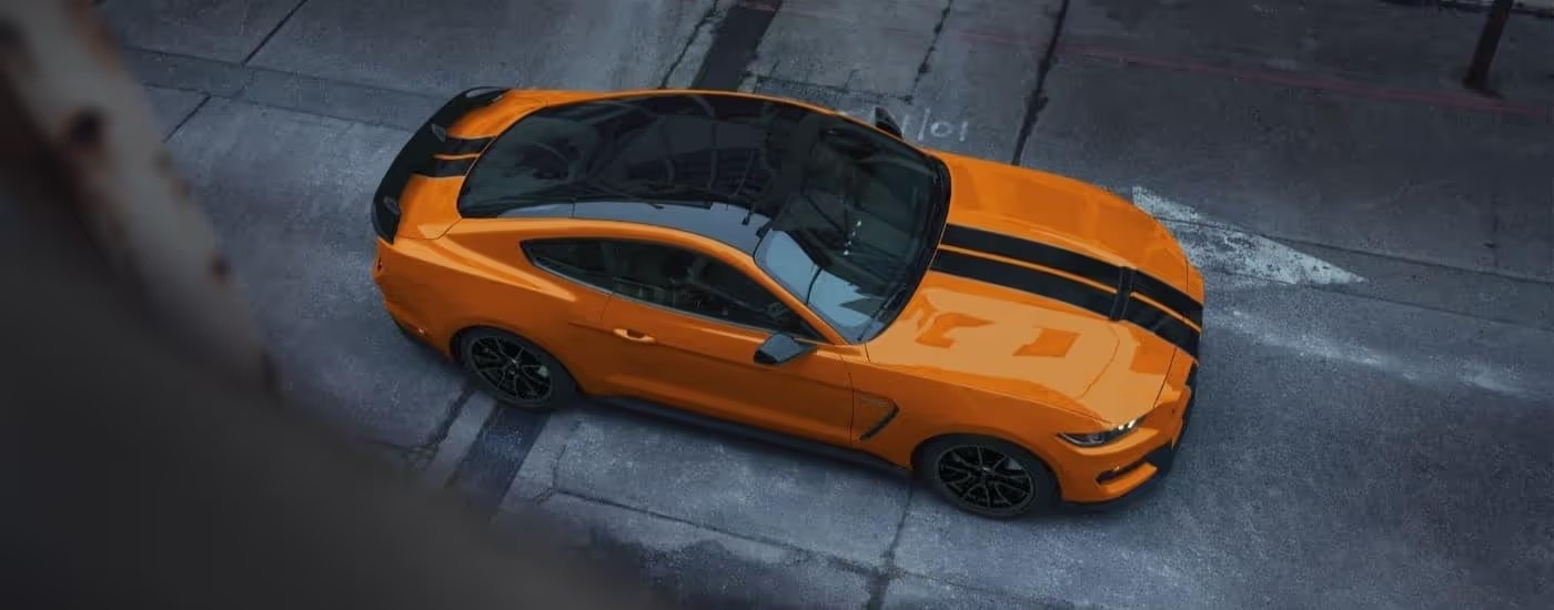 An orange 2020 Ford Mustang GT350 is shown in an alleyway after leaving a Dunwoody Ford dealer.