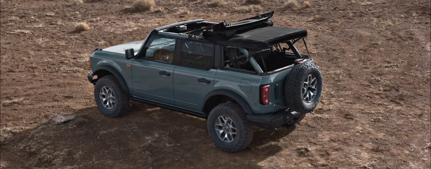 Blue 2026 Ford Bronco parked off-road at an angle