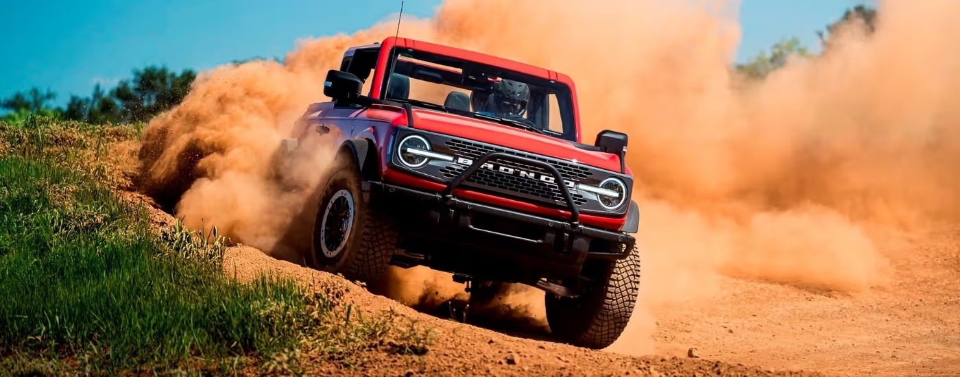 A red 2021 Ford Bronco Wildtrak off-roading.