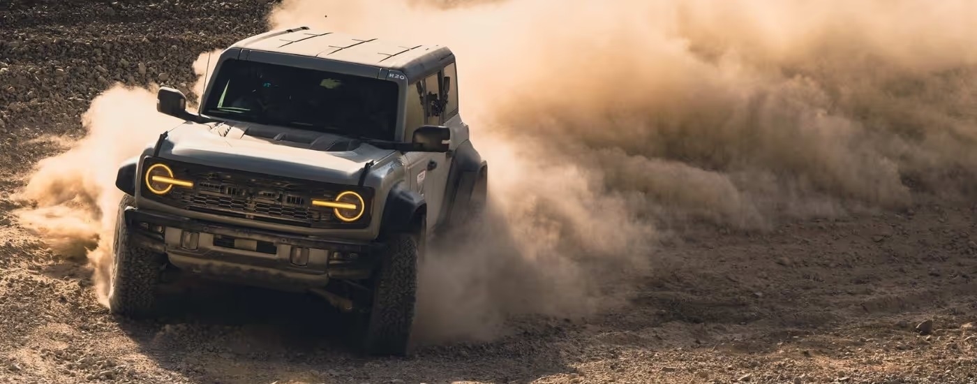 A gray 2025 Ford Bronco off-roading in dirt