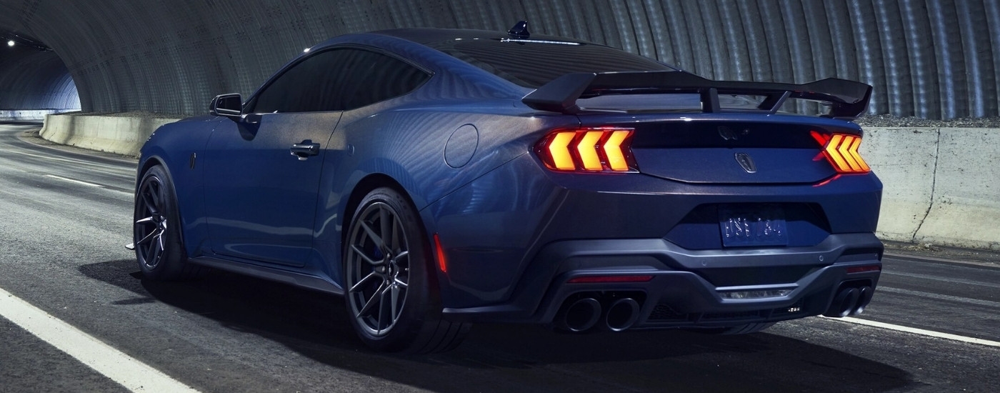 Blue 2025 Ford Mustang Dark Horse in a tunnel