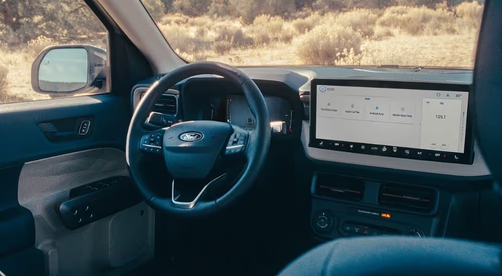 Infotainment display and steering wheel on a 2026 Ford Maverick.