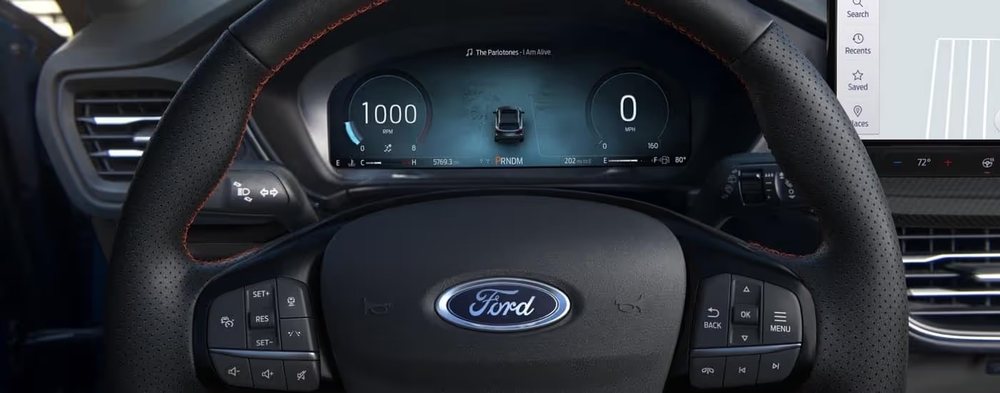 Close-up of the steering wheel and digital instrument cluster in a 2025 Ford Escape.